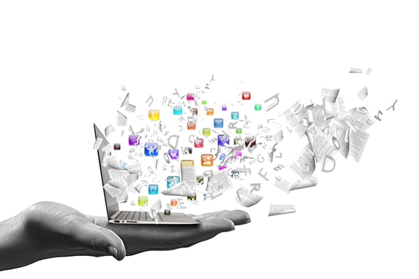 Close up of hand with laptop and media icons